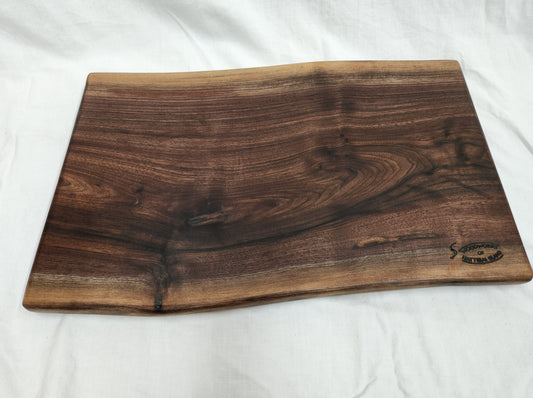 Live edge black walnut charcuterie board, long, wide and wavy.  Beautiful charcuterie board.